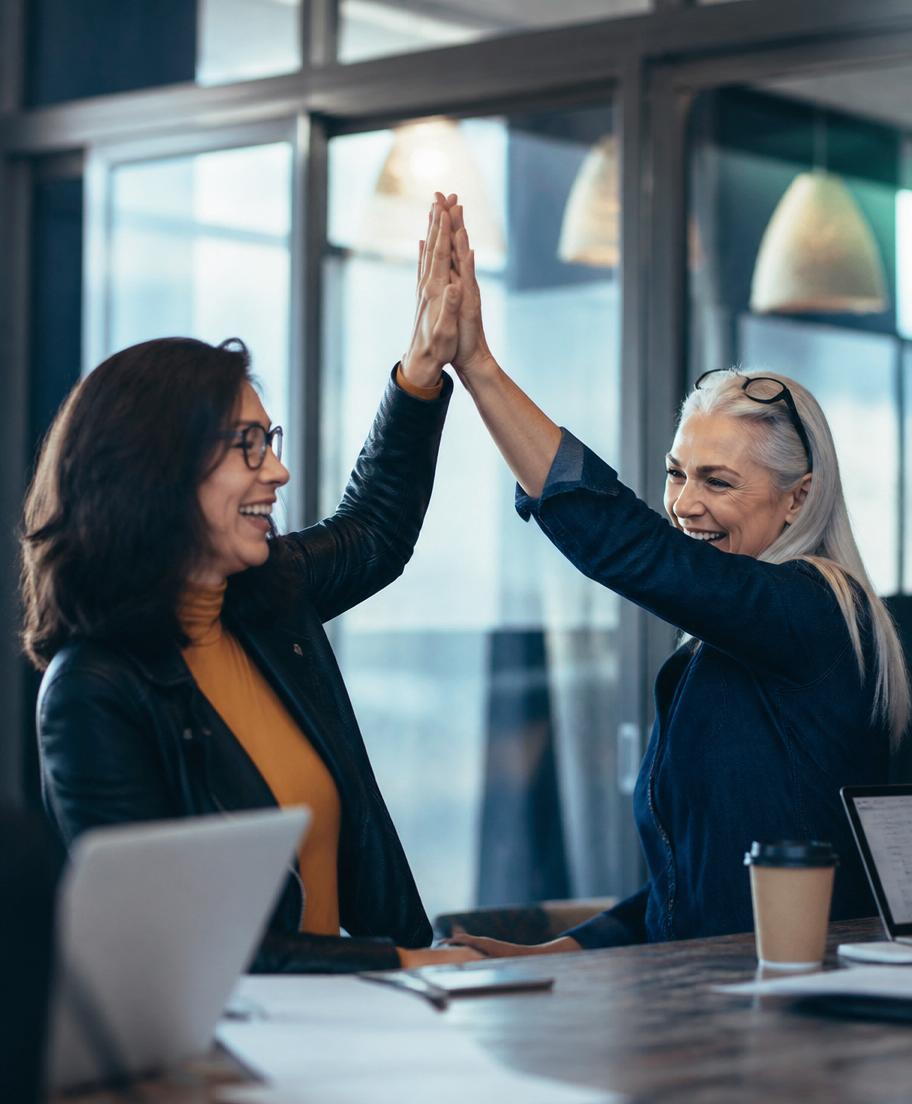 Two women celebrating a shared success